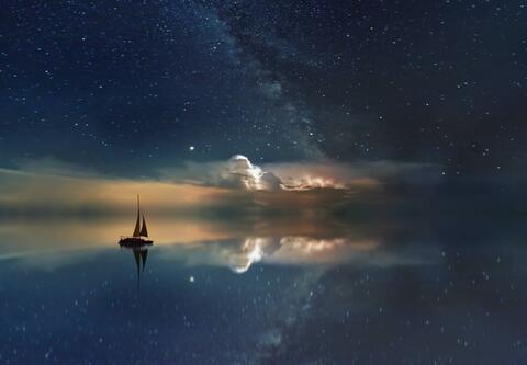 ship sailing in stars