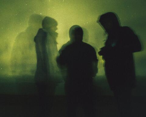 black silhouettes on a green background