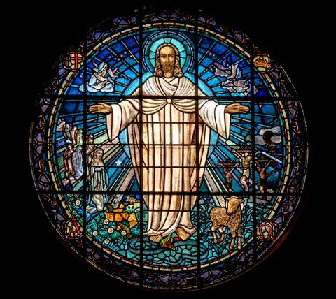 round stained glass window depicting Jesus