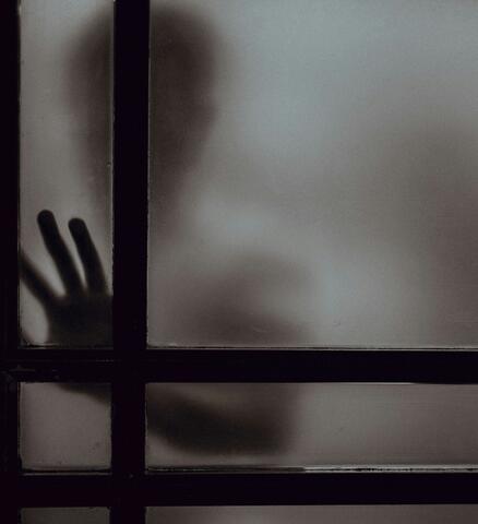 hand on glass window