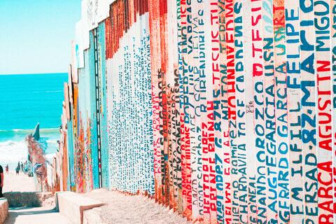 names painted on Mexican border wall