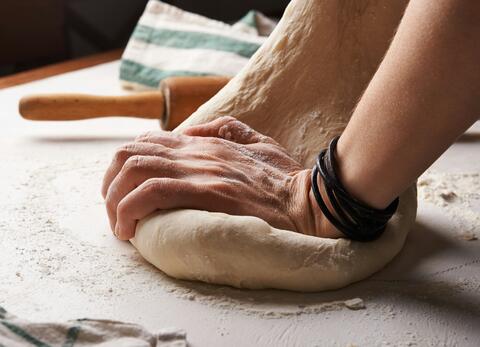 hands kneading bread