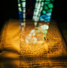 manuscript with stained glass superimposition